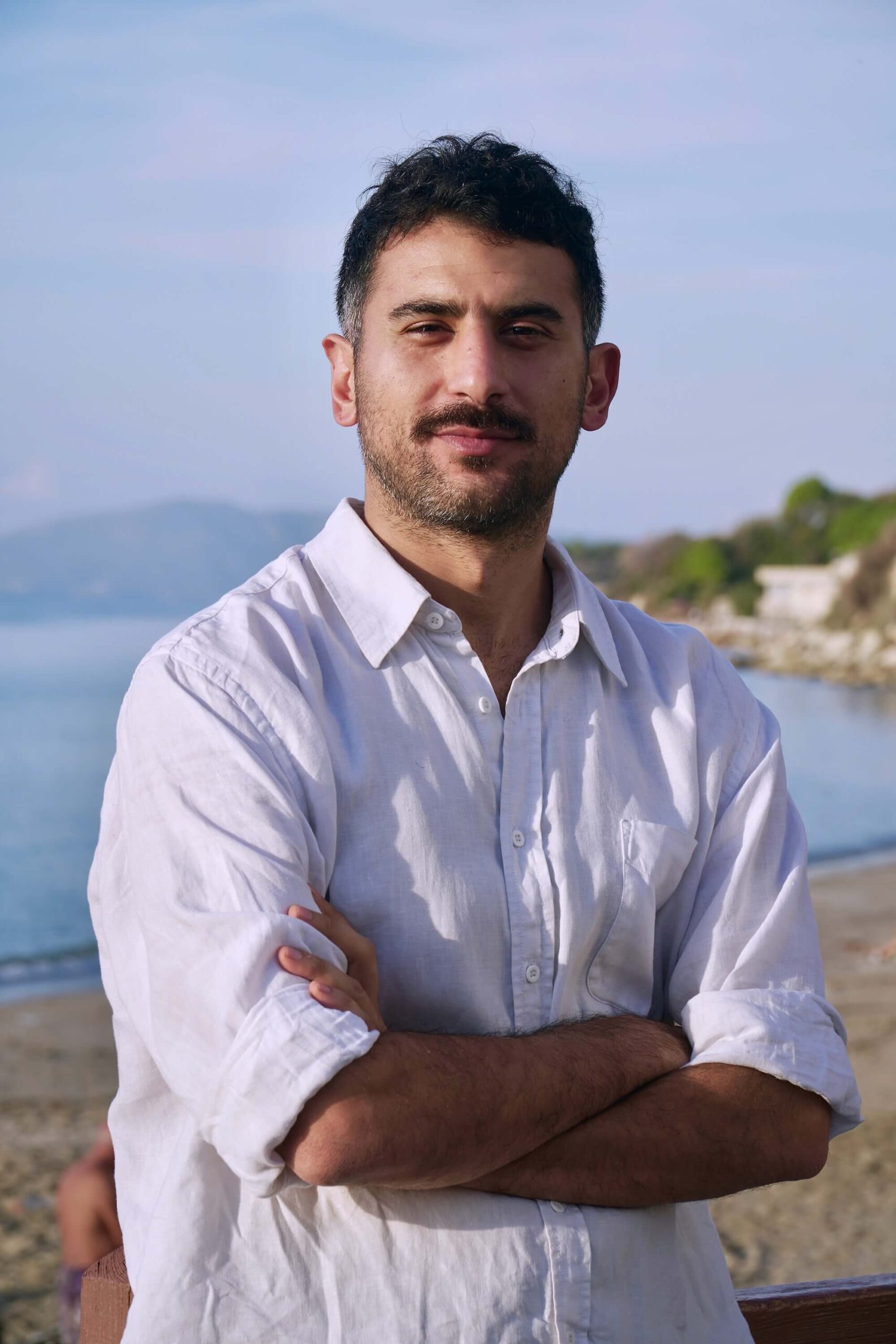 Navid Yousefian Portrait standing against a sea